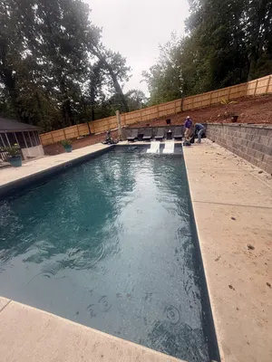 Workers Finishing New Rectangular Pool Ball Ground