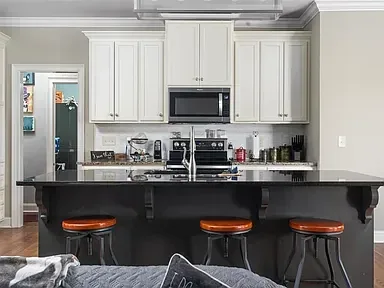 Kitchen Remodel Dark Island White Cabinets 2 project in Oklahoma City, OK