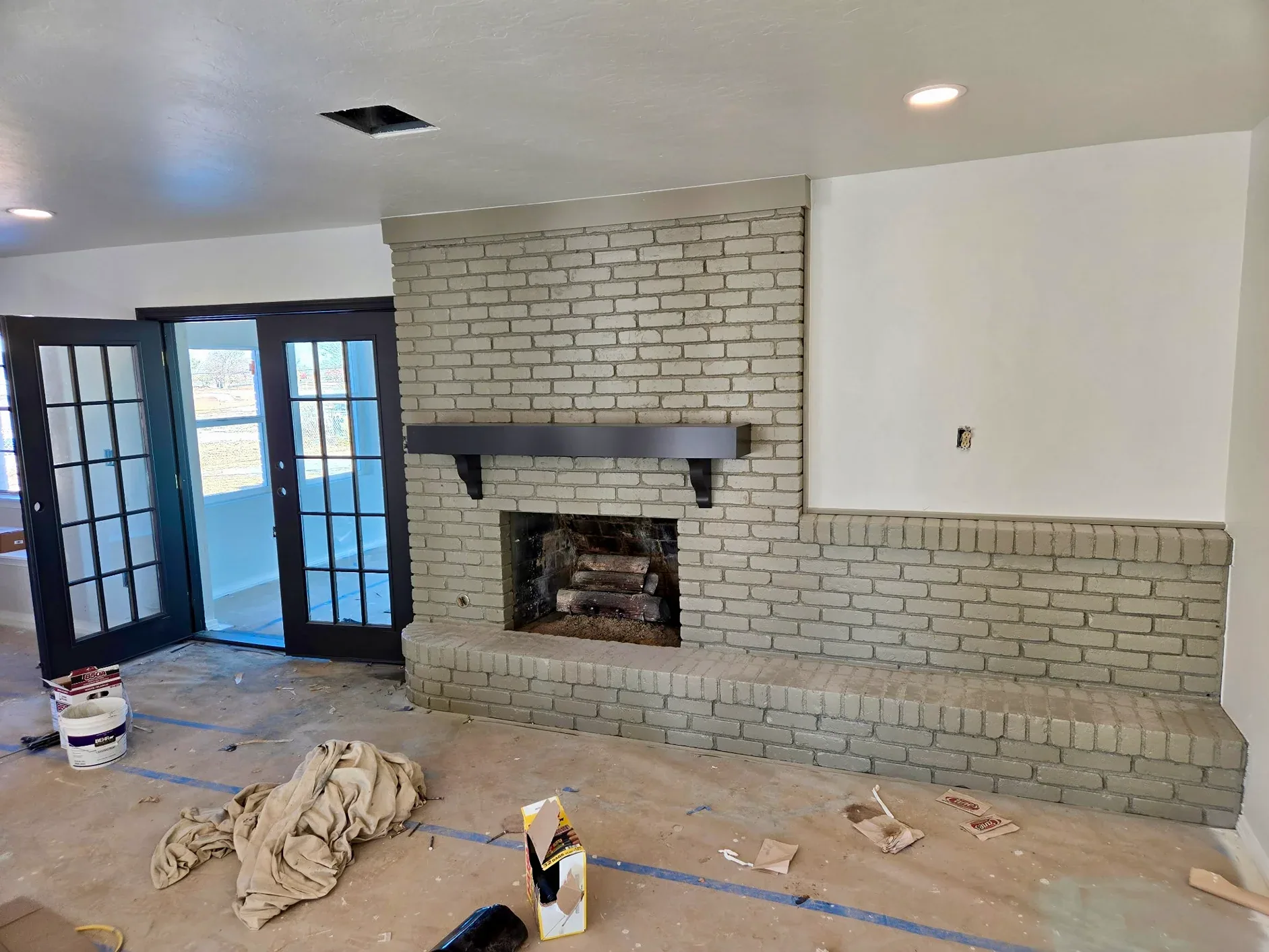 Living Room Remodel Painted Brick Fireplace project in Oklahoma City, OK
