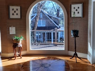 Arched Picture Window Sunroom Hardwood Floor