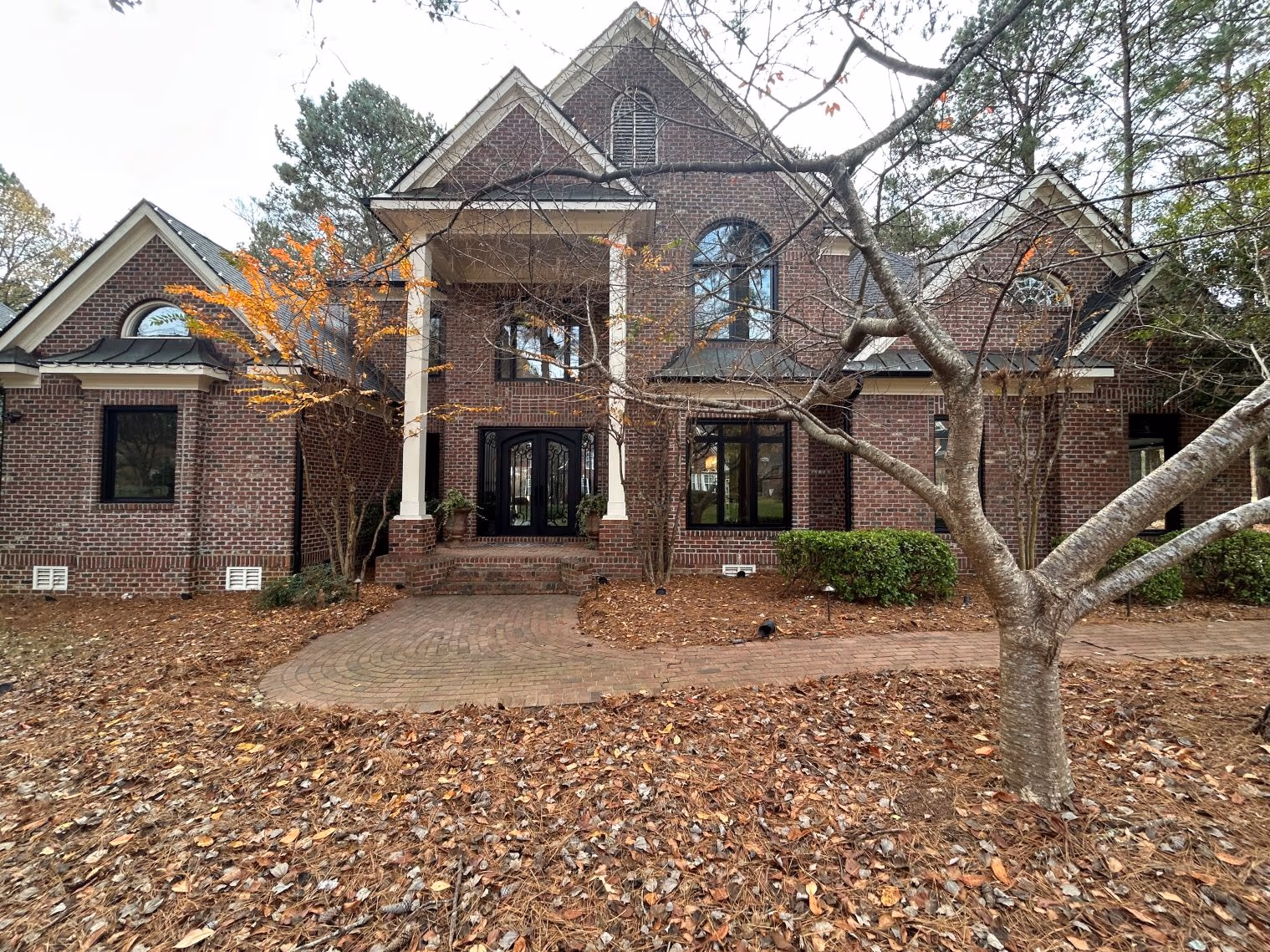 Brick Estate Black Double Door Arched Windows