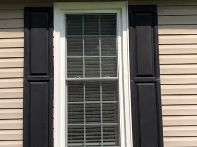 Double Hung Window Black Shutters Beige Siding