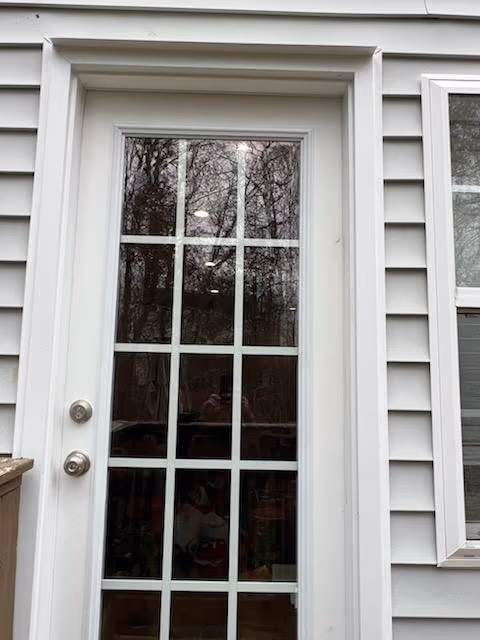White Full Lite Grid Door Gray Siding